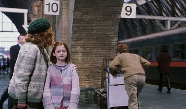 Molly Weasley advises Harry Potter on how to cross the barrier at King Cross platform 9¾